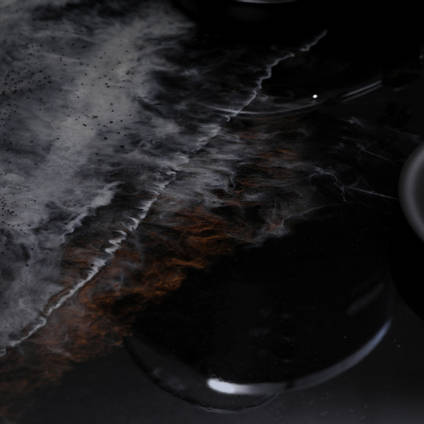 GlassCast Cosmic Black Granite Resin Countertop Coffee Cup Closeup