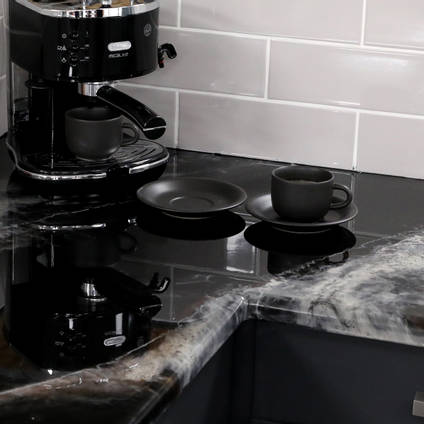 GlassCast Cosmic Black Granite Resin Countertop with Coffee Machine on Diagonal