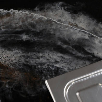 GlassCast Cosmic Black Granite Resin Countertop Sink Corner Shot