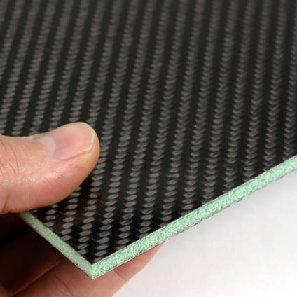 Foam Cored Carbon Fibre Panel in Hand Closeup