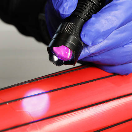 UV Torch Curing 130UV Adhesive on Red Printed Part with Carbon Fibre