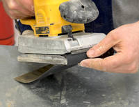 Abrasive Paper Being Fitted to an Orbital Sander Thumbnail
