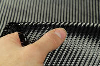 210g 2x2 Twill 3k Carbon FibreÂ Cloth In Hand Closeup Thumbnail