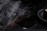 GlassCast Cosmic Black Granite Resin Countertop Coffee Cup Closeup Thumbnail