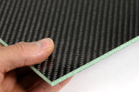 Foam Cored Carbon Fibre Panel in Hand Closeup Thumbnail
