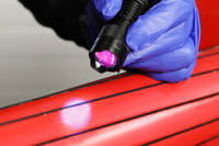 UV Torch Curing 130UV Adhesive on Red Printed Part with Carbon Fibre Thumbnail